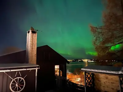 a view of the aurora from the deck of a cabin at Atlantic View Ingerstua in Frei