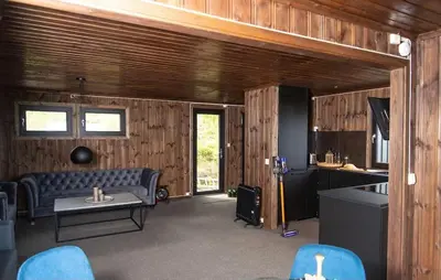 a living room with a couch and a table at Atlantic View Ingerstua in Frei