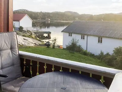 a balcony with a view of a body of water at 6 person holiday home in averøy-By Traum in Averoy