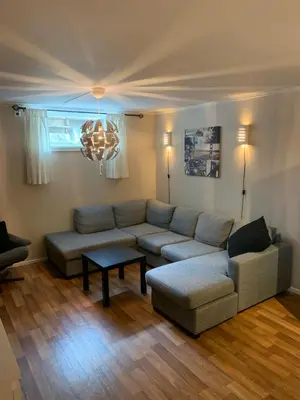 a living room with a couch and a table at Two bedroom apartement in Sogndal