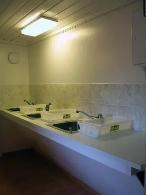 a bathroom with two sinks on a counter at Lunde Camping in Aurland
