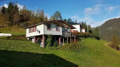 a house on the side of a hill at Leilighet 2240 in Haugsvær