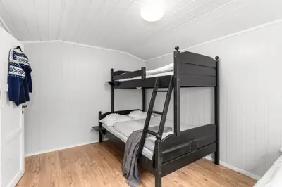 a bedroom with two bunk beds in a room at Topcamp Rustberg - Hafjell in Hafjell
