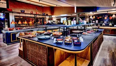 a buffet line with many food items on it at Savalen Fjellhotell & Spa in Tynset