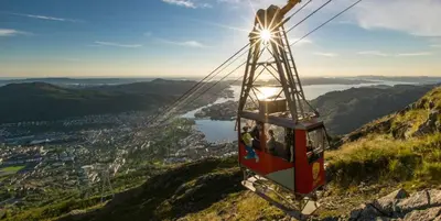 a gondola ride up a mountain in the mountains at Nedre Stølen Apartment Bergen in Bergen