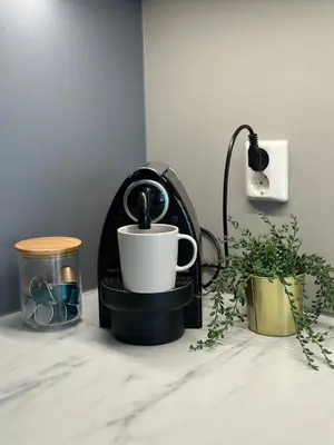 a coffee maker and a cup on a counter at Nedre Stølen Apartment Bergen in Bergen