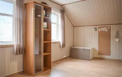 an empty room with a closet and a window at Cozy Home In Etne With Wifi in Kyrping