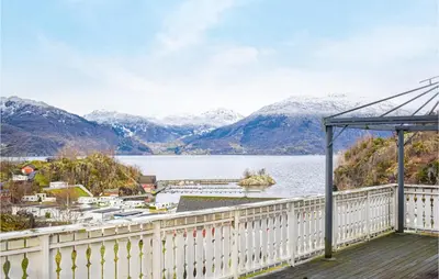a balcony with a view of a lake and mountains at Cozy Home In Etne With Wifi in Kyrping