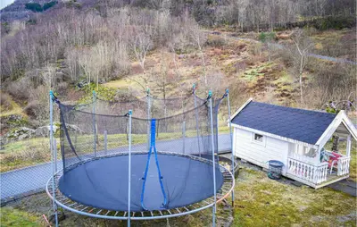 an aerial view of a playground with a house at Cozy Home In Etne With Wifi in Kyrping