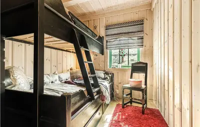 a bedroom with a bunk bed in a wooden room at 4 Bedroom Stunning Home In Hemsedal in Hemsedal