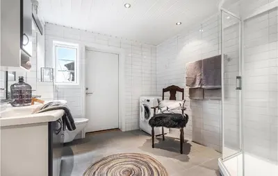 a bathroom with a shower and a toilet and a sink at 4 Bedroom Stunning Home In Hemsedal in Hemsedal