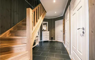 a hallway with wooden stairs in a house at Stunning Home In Rauland With Wifi in Rauland