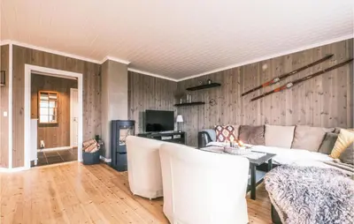 a living room with a couch and a table at Stunning Home In Rauland With Wifi in Rauland