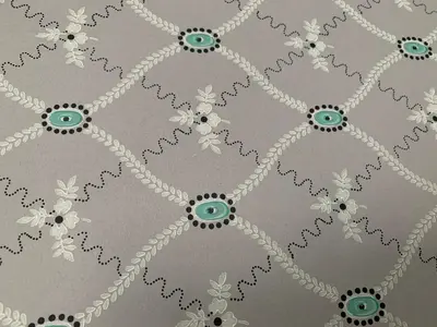 a pattern of white flowers on a gray background at Old town boutiqe apartments/ Gamle Lærdalsøyri boutique leiligheter in Lærdalsøyri