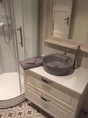 a bathroom with a sink and a toilet and a shower at Old town boutiqe apartments/ Gamle Lærdalsøyri boutique leiligheter in Lærdalsøyri