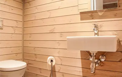 a bathroom with a toilet and a sink at Privat'n in Hemsedal