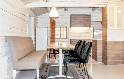 a kitchen with a table and chairs in a room at Privat'n in Hemsedal