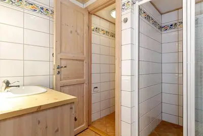a bathroom with a sink and a shower at Tinden in Hemsedal