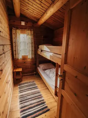 a room with two bunk beds in a cabin at Ryen Hytteutleie - Cottages in Røros