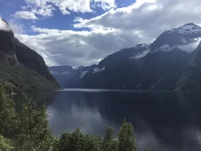 a lake in the middle of a mountain range at Iris Vedal in Nauste