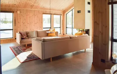 a living room with a couch and some windows at Amazing Home In Flå With Wifi in Flå
