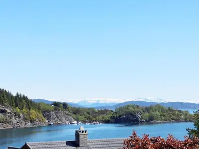 a view of a river with mountains in the background at 7 person holiday home in KLOKKARVIK in Klokkarvik