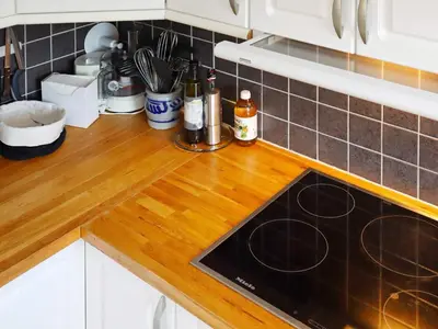 a kitchen counter with a wooden counter top at 7 person holiday home in KLOKKARVIK in Klokkarvik
