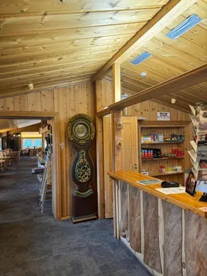 a large clock in the middle of a room at Toftemo Turiststasjon in Dovre