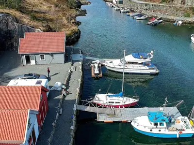 a group of boats are docked in a harbor at 12 person holiday home in Fitjar in Fitjar