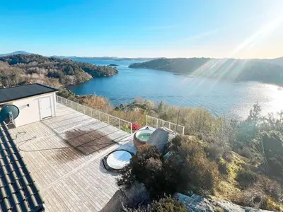 a house with a view of a river at 12 person holiday home in Fitjar in Fitjar