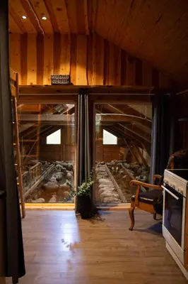a room with a loft bed with a view of a river at Unik fjøsleilighet in Levanger
