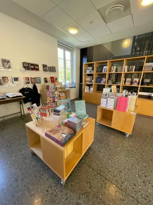 a library with two tables with books on them at Falstadsenteret - Museum, minnested og senter for menneskerettigheter in Levanger