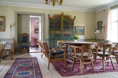 a dining room with a table and chairs at Kongsvold Fjeldstue by Frich`s in Oppdal