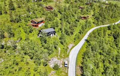 an aerial view of a road and a house on a hill at Stordalen in Bjordal