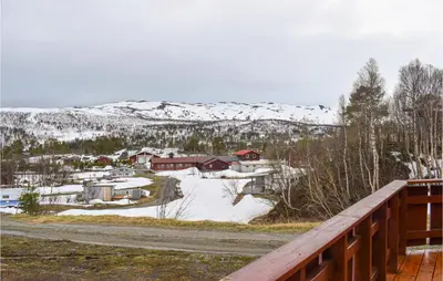 a view from the deck of a house in the snow at 3 Bedroom Lovely Home In Nordberg in Skjåk