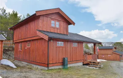 a large wooden cabin with a gambrel roof at 3 Bedroom Lovely Home In Nordberg in Skjåk