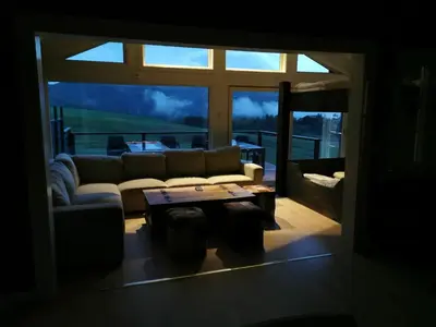 a living room with a couch and a table at STORHAUGEN GARD in Lom