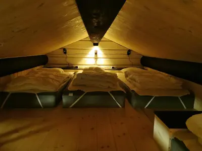 a room with two beds in a attic at STORHAUGEN GARD in Lom