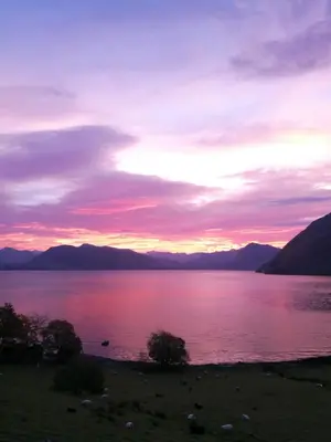 a sunset over a large body of water at Irenegarden - Fjord view holiday home in Lauvstad