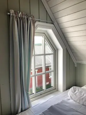 a window in a bedroom with a bed and a window at Villa Sole, Trysil in Trysil