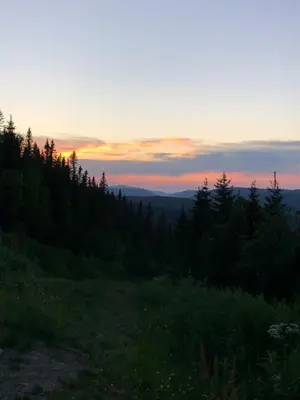 a view of the sunset from the top of a hill at Villa Sole, Trysil in Trysil