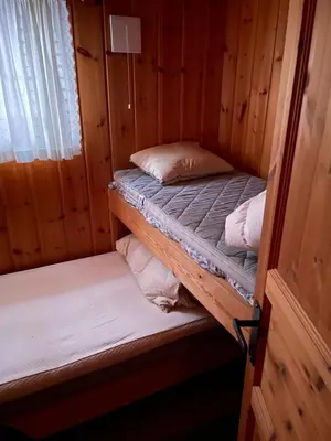 a room with two bunk beds in a cabin at Ski and Bike-In and Out in Hafjell