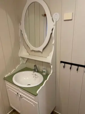 a bathroom with a sink and a mirror at Ski and Bike-In and Out in Hafjell