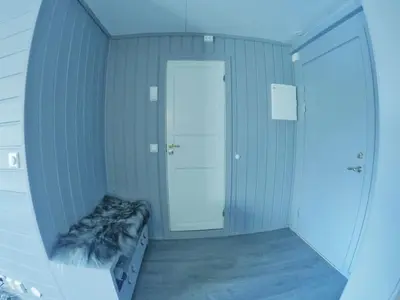 a room with a hallway with a bed and a door at Fjellstova Storehorn Apartments in Torset