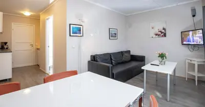 a living room with a couch and a table at Lillehammer Camping in Lillehammer