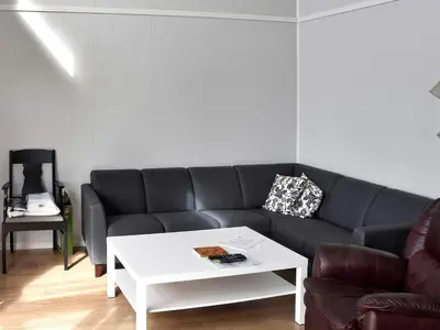 a living room with a couch and a coffee table at 6 person holiday home in Dyrvik in Dyrvik