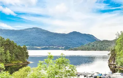 a view of a lake with mountains in the background at Beautiful Apartment In Årland With Wifi in Hålland