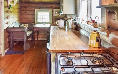 a kitchen with a stove and a counter top at Høgesset in Feiring