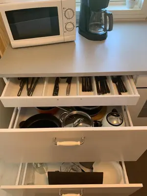 a microwave oven sitting on top of a kitchen drawer at Private house-terrace-garden -parking-WiFi-smartTV in Trondheim