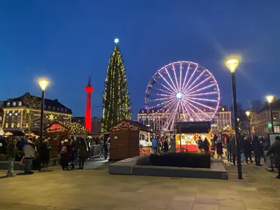 a christmas tree and a ferris wheel in a city at Private house-terrace-garden -parking-WiFi-smartTV in Trondheim